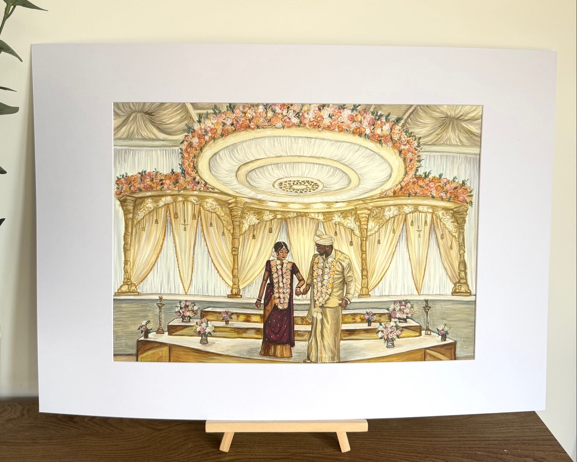 Colour wedding ceremony portrait of a couple under an ornate mandap