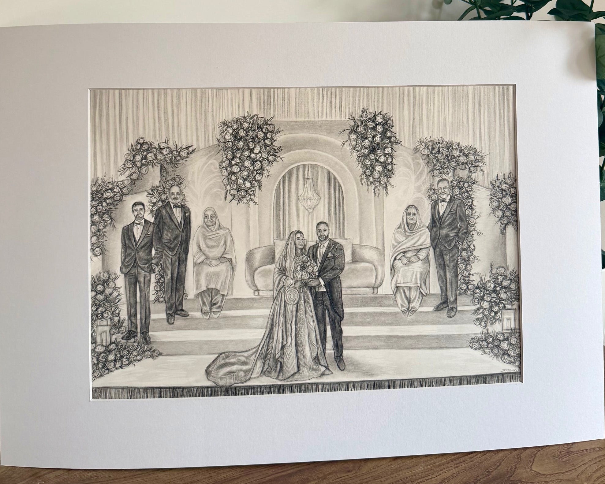 Wedding ceremony portrait with couple, family and floral arch backdrop