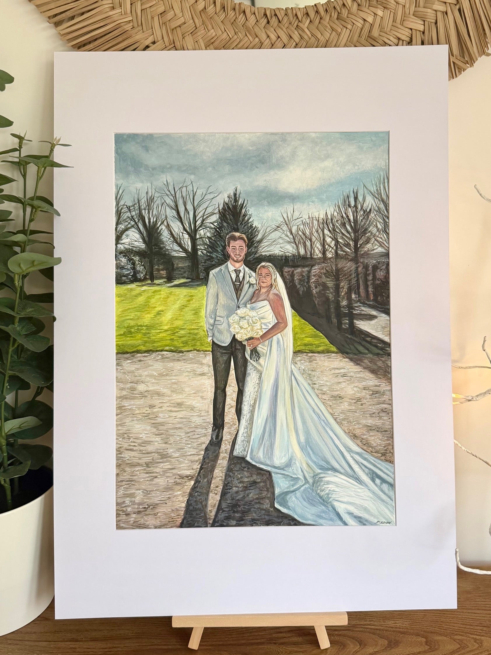 Colour wedding portrait of a bride and groom on a country lane with trees